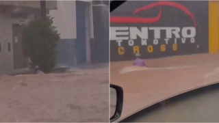 Motociclista tenta salvar moto levada pela enxurrada durante temporal em Montes Claros