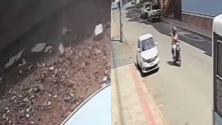 Estrutura despenca de prédio e quase atinge motociclista no Centro de Alegre