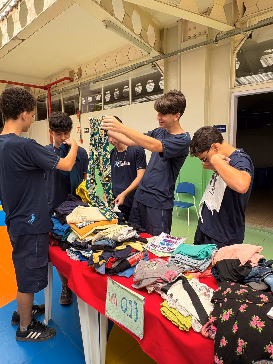 Fwd: Colégio Católica Padre de Man promove Garage Sale com venda de produtos usados